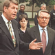 Left: Child-rearing expert Dr. Patrick Coughlin and Korean War expert Dr. Laurence Block field reporters' questions following the mass resignation of America's 243,839 experts.